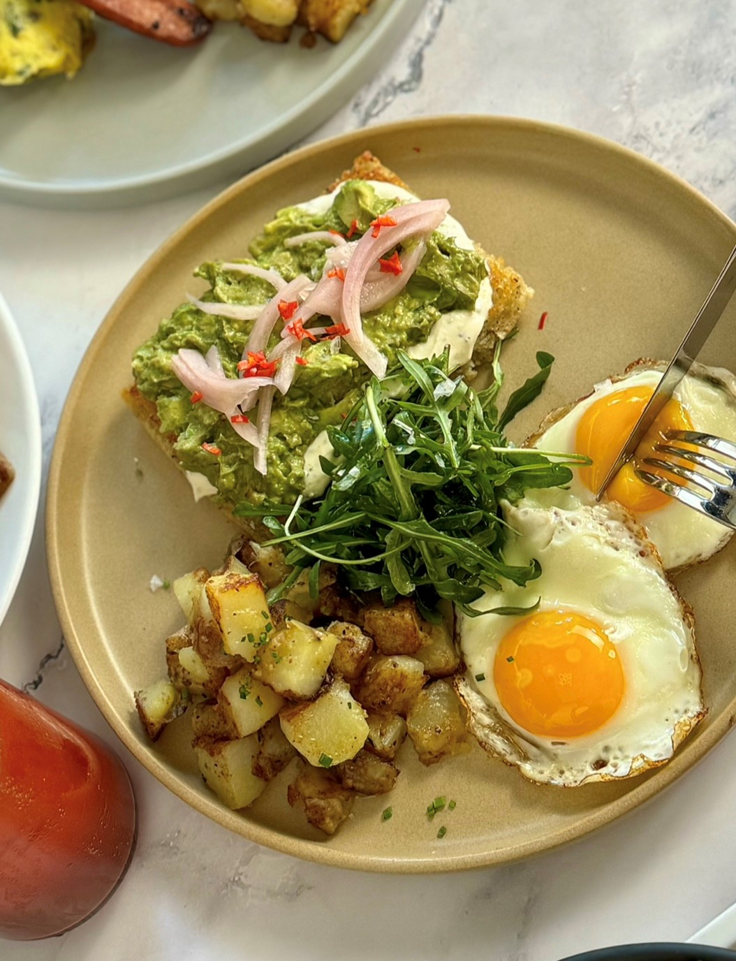 Duffey's Sports Grill brunch dish with eggs, potatoes and avocado