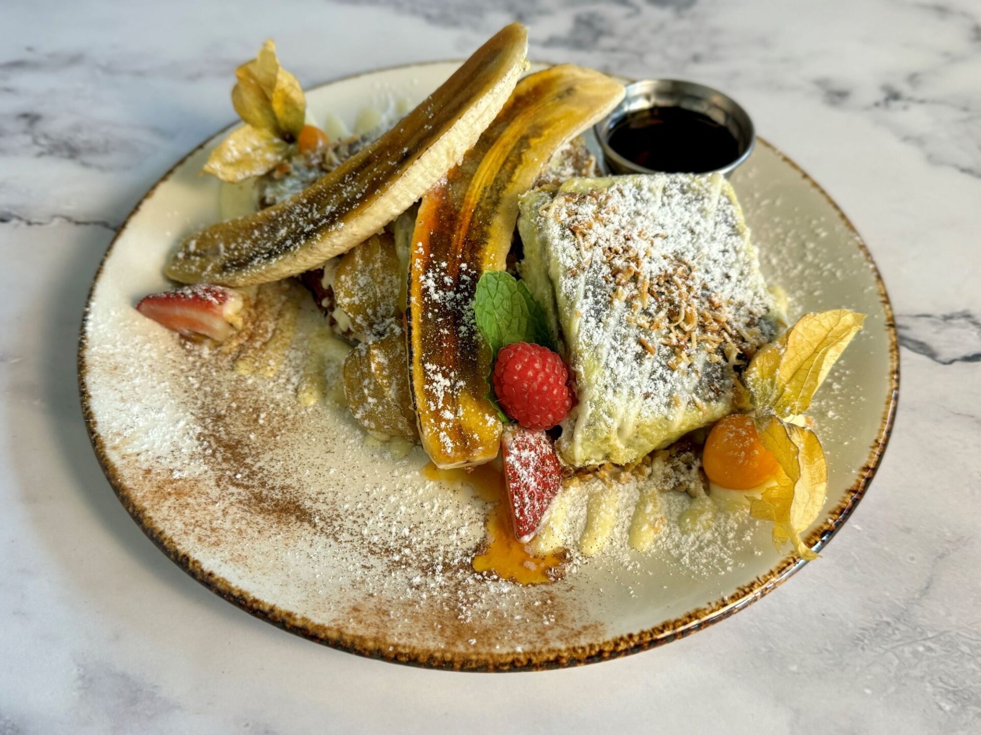 Duffey's Sports Grill brunch dish with crepes and various fruits