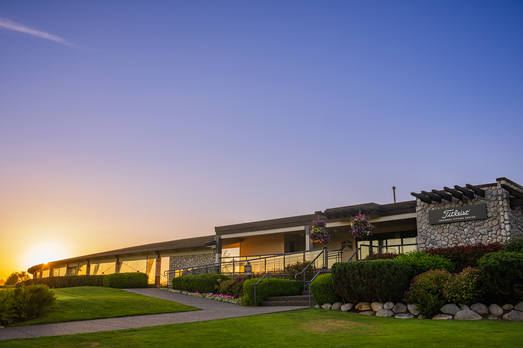 Front entrance of the Titleist Fitting Range at dusk