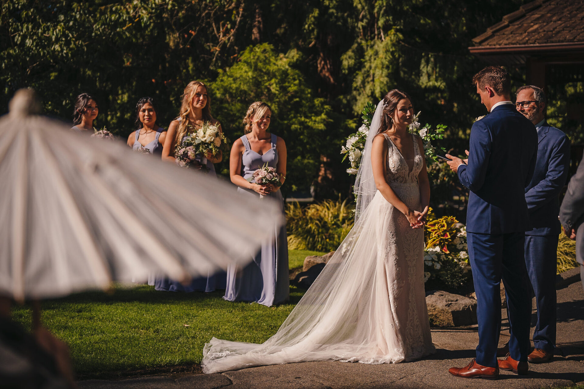 View of the bridal pary as the groom reads his vows