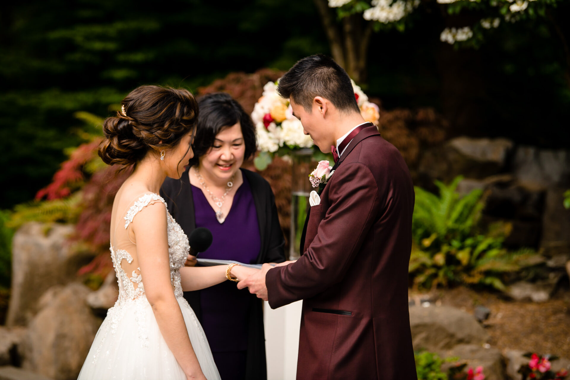 Groom inserting the ring on to the bride's finger
