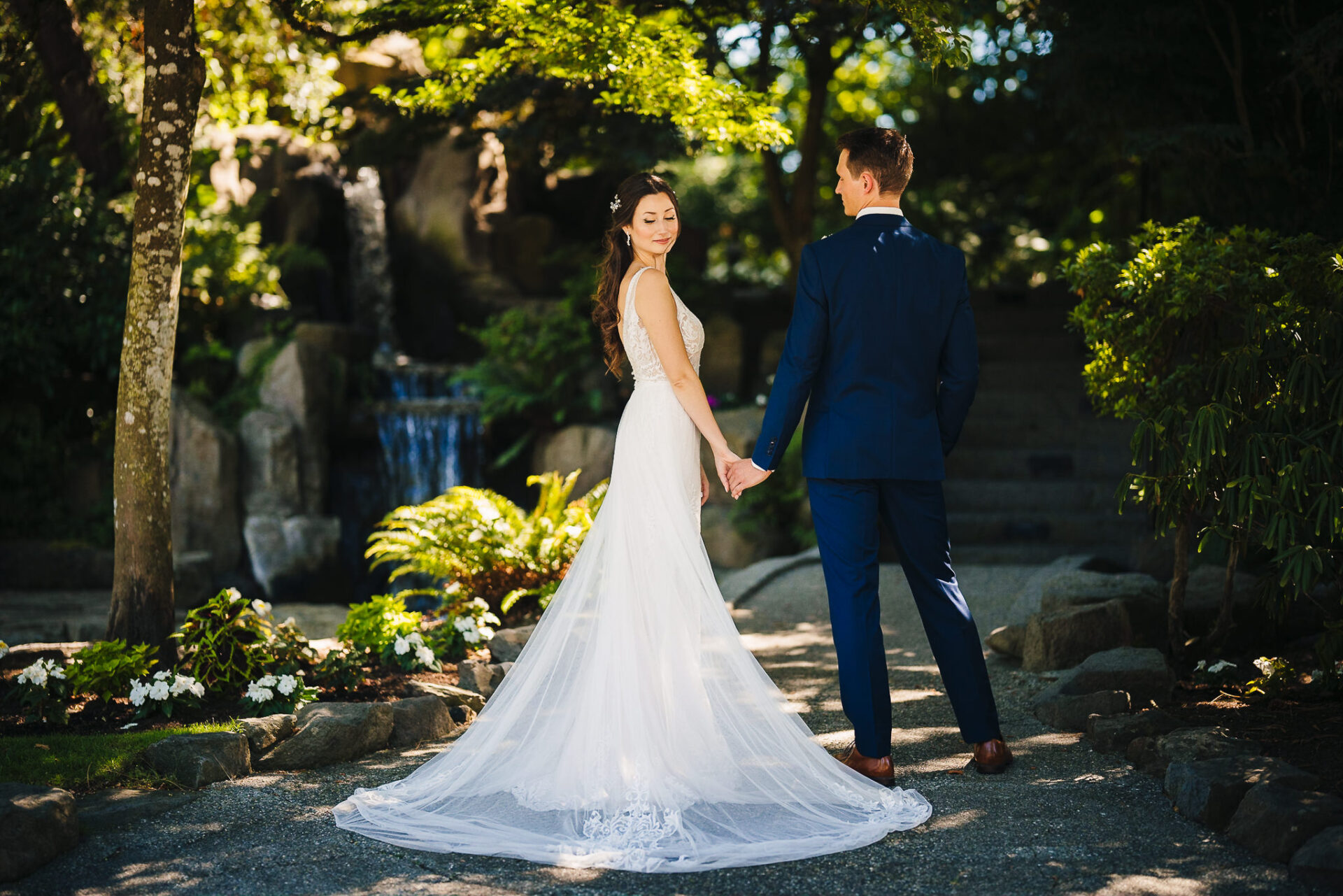 Bride and groom holding hands