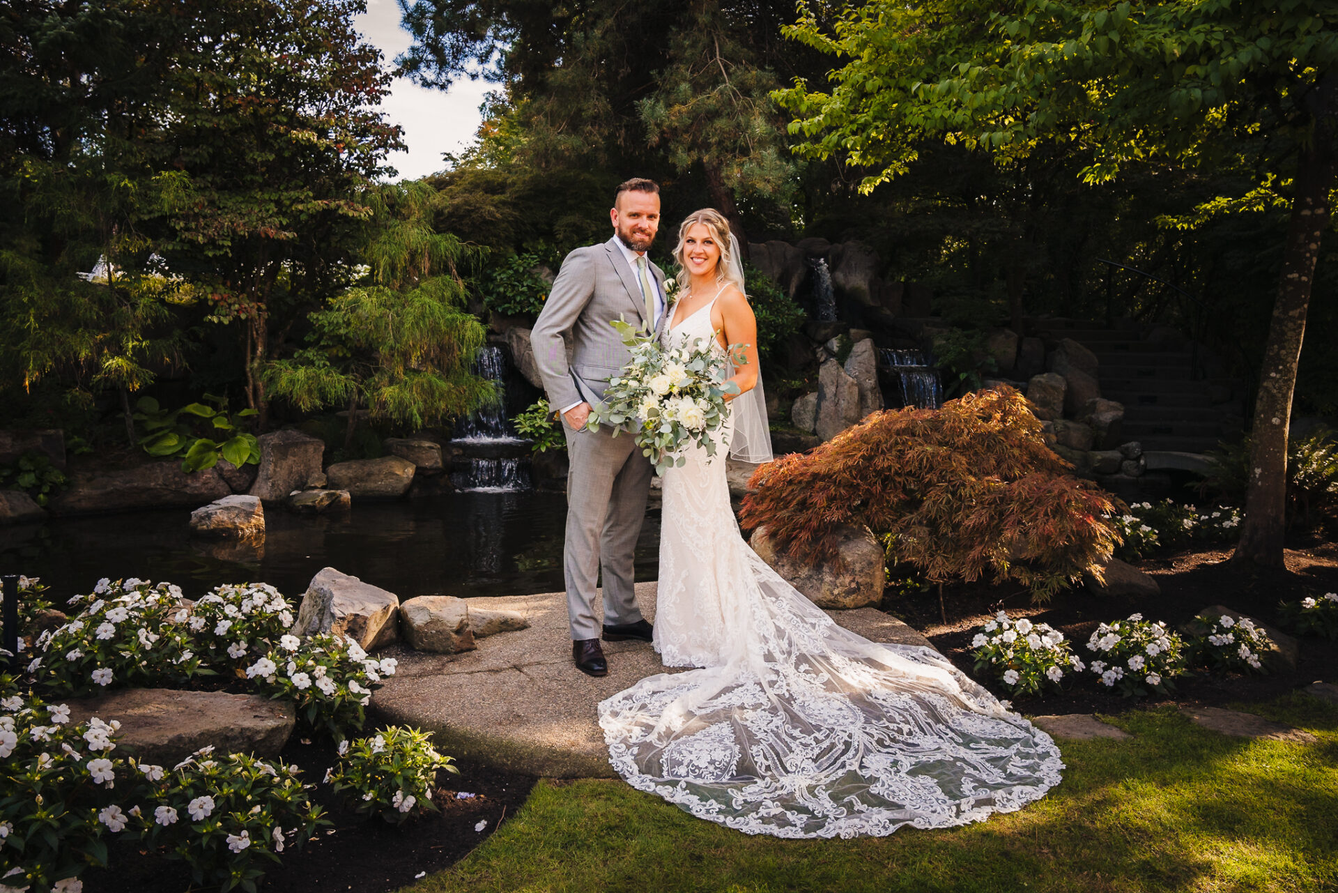 Bride and groom smiling while posing for a photo