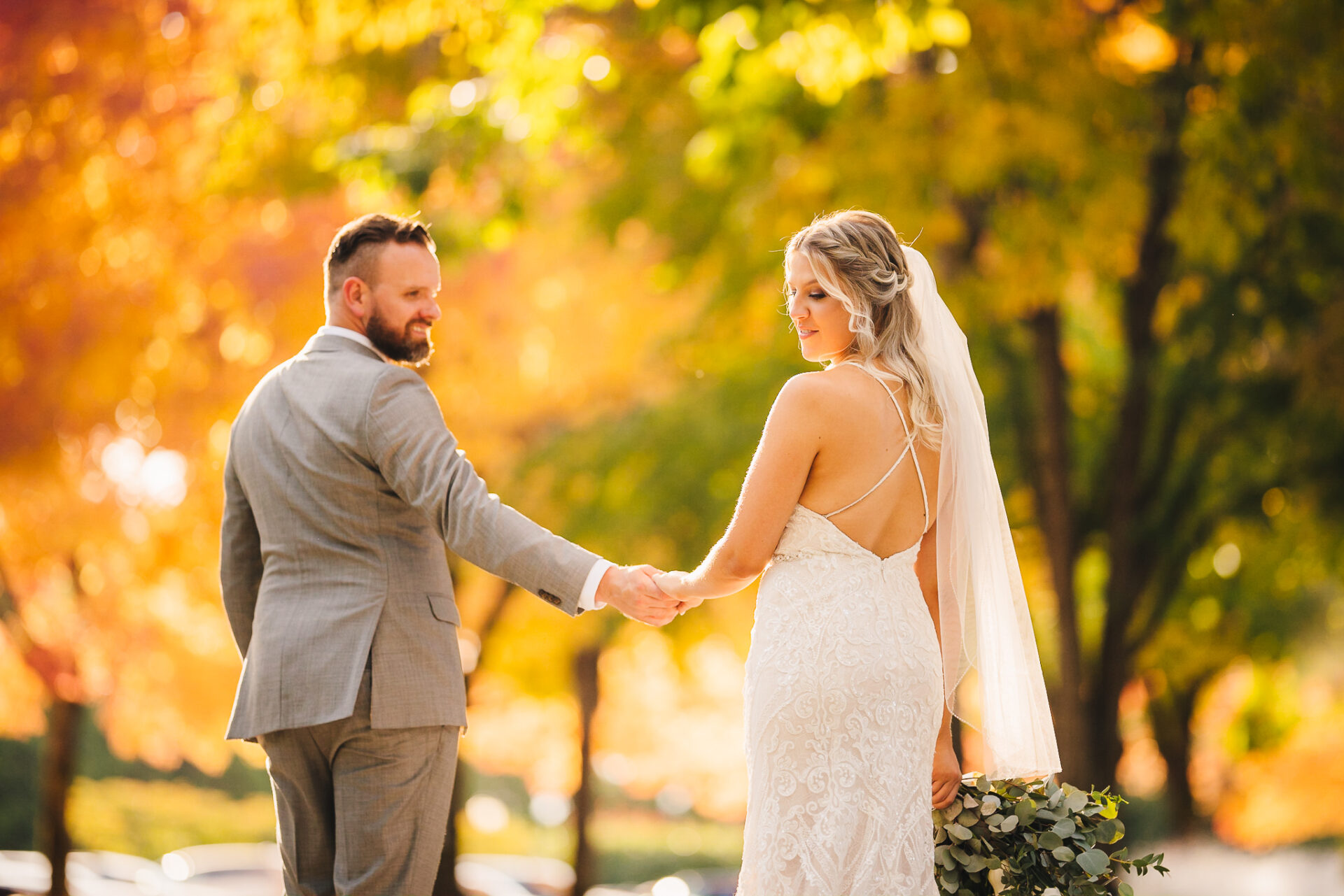 Bride and groom holding hands