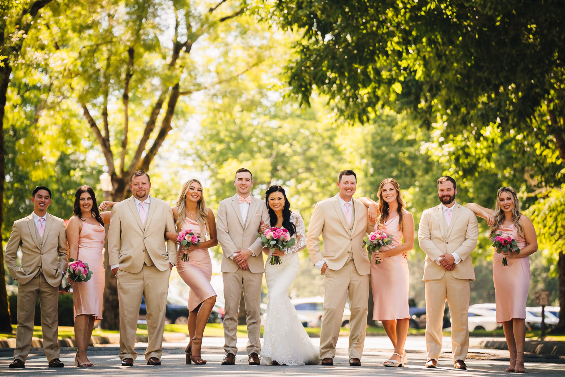 Wedding party happily posing for a photo