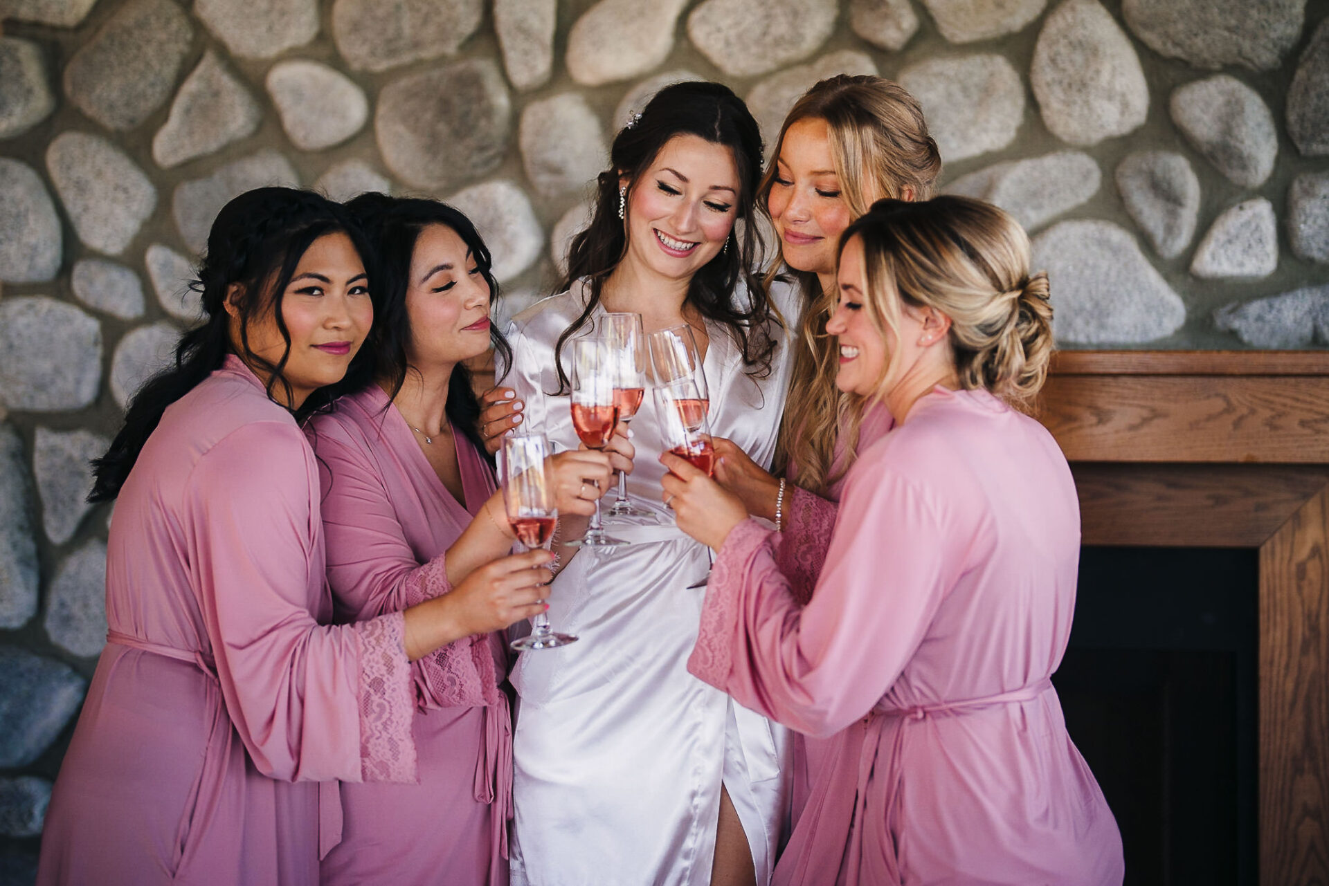 Bridal party doing their cheers with drinks