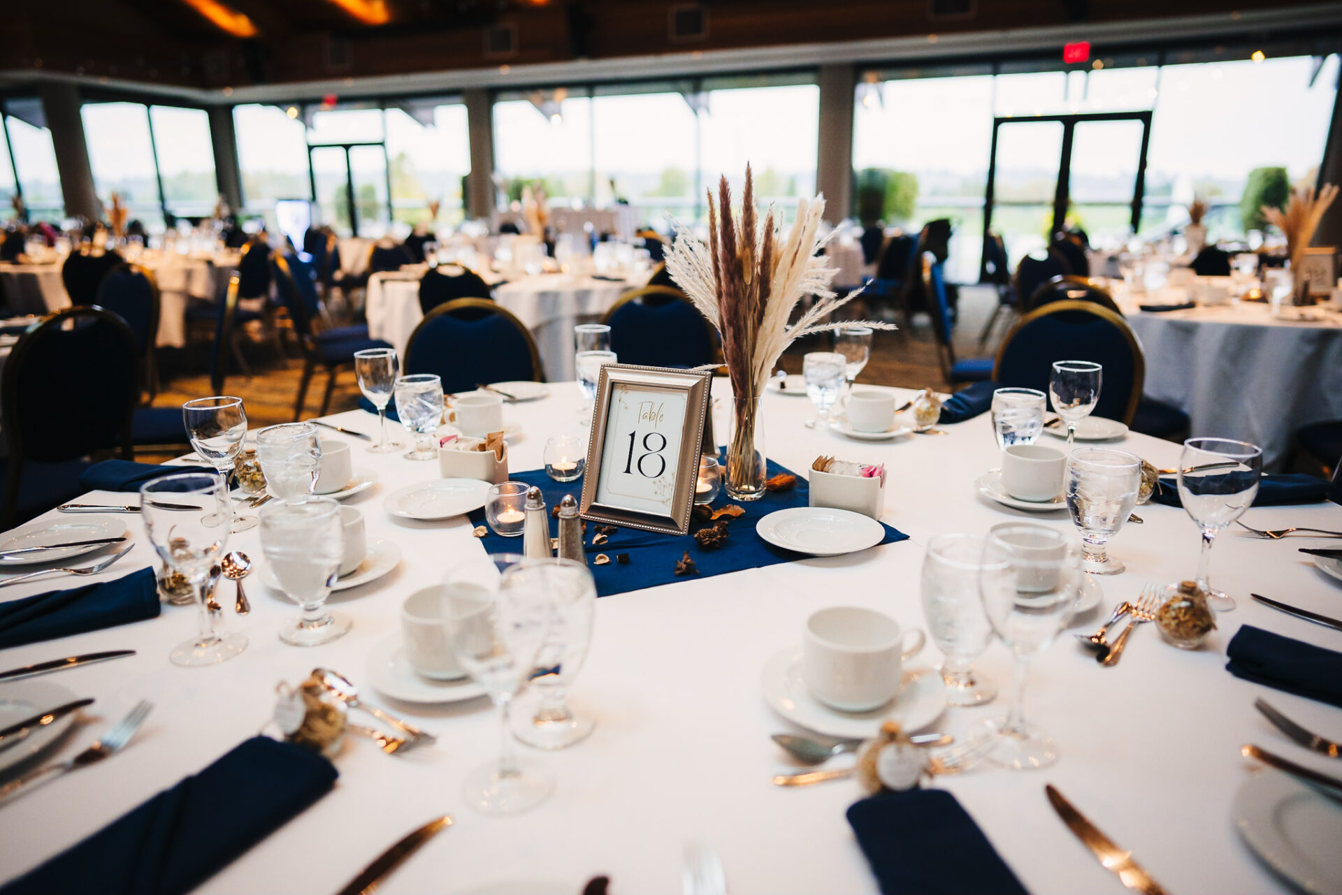 Close up of a table neatly set with cups and cutlery