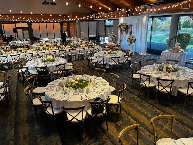 View of tables and chairs set up within the banquet hall