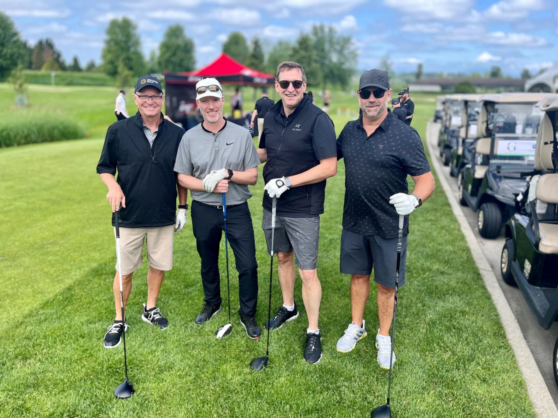 Group of male golfers posing for a photo