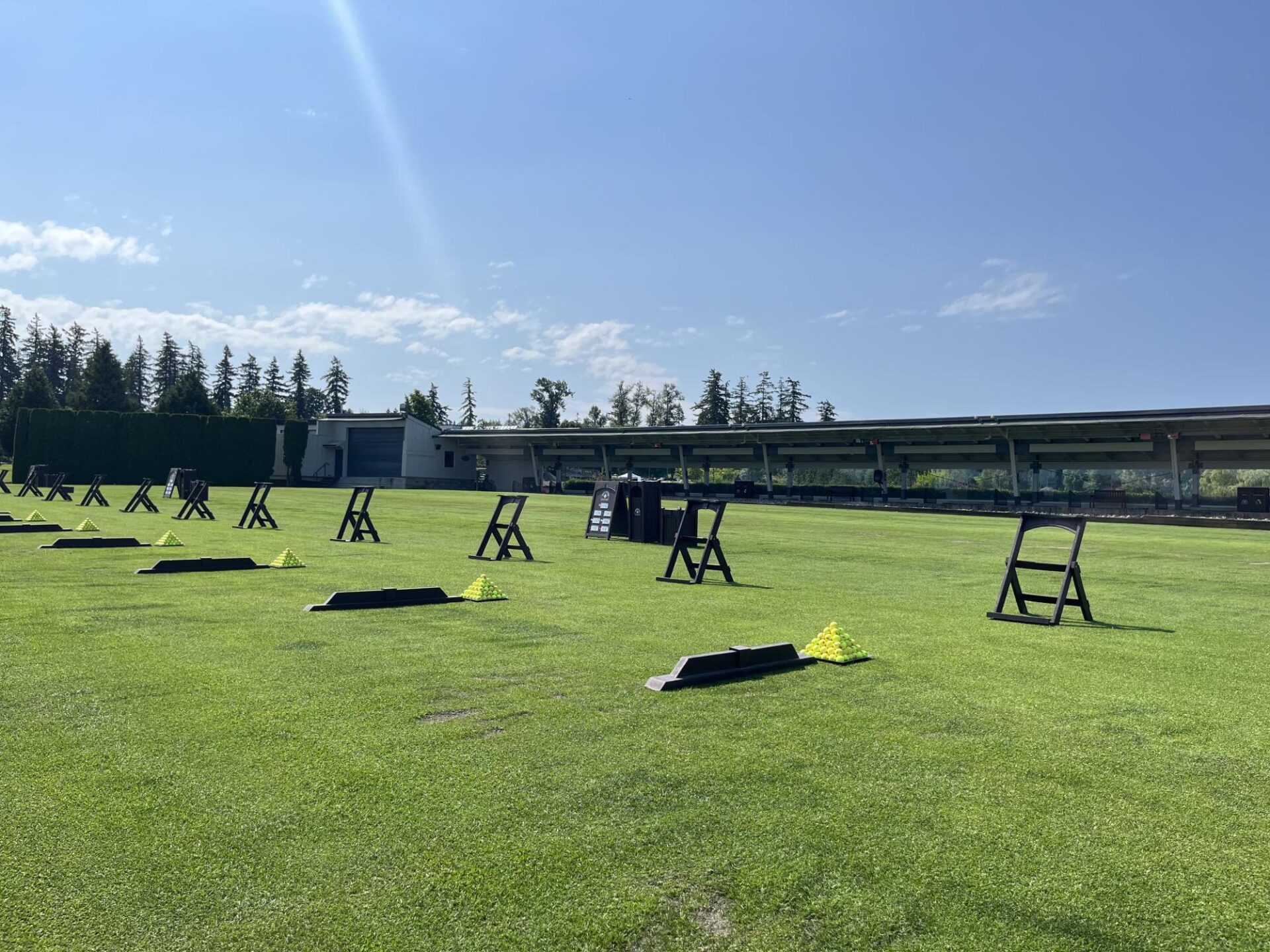 Golf stations meticulously set up at the range