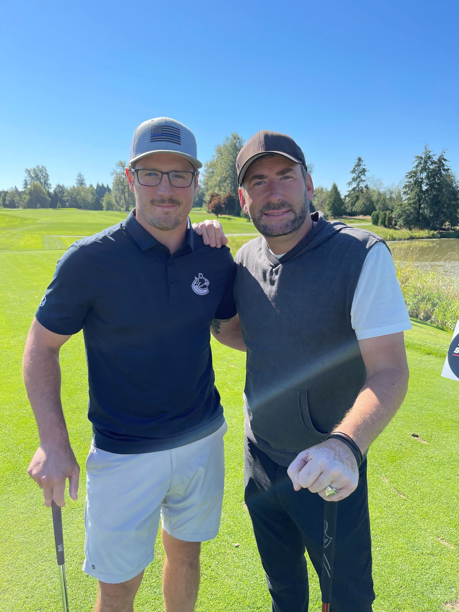 J.T. Miller of the Vancouver Canucks and Chad Kroeger of Nickelback posing for a photo