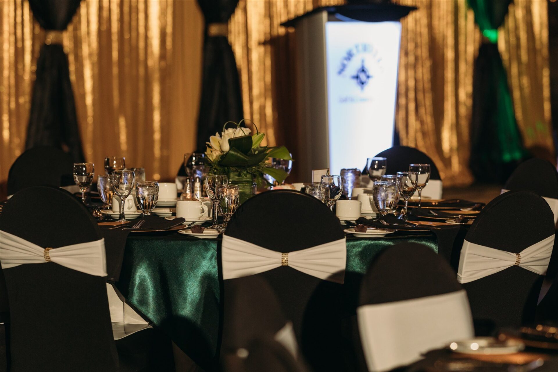Close up of a beautifully set table with cutlery, plates and glasses